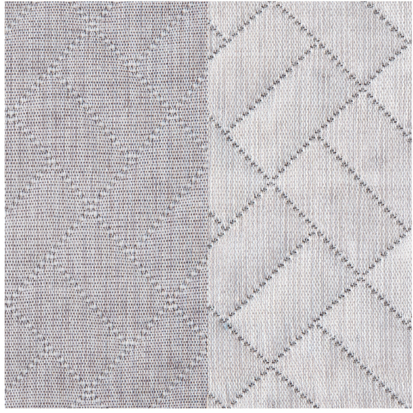 Close-up of Savannah coverlet showing grey and ivory woven diamond texture contrast.