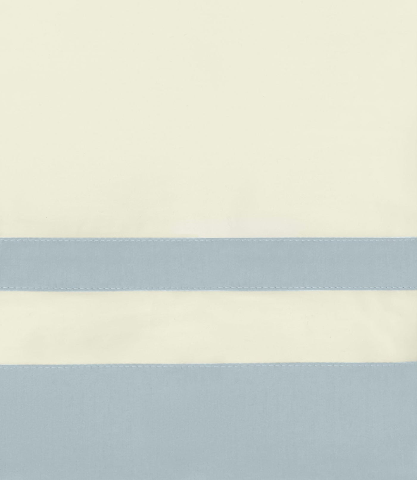 Close-up of ivory and powder blue color-block border with topstitched trim detail.