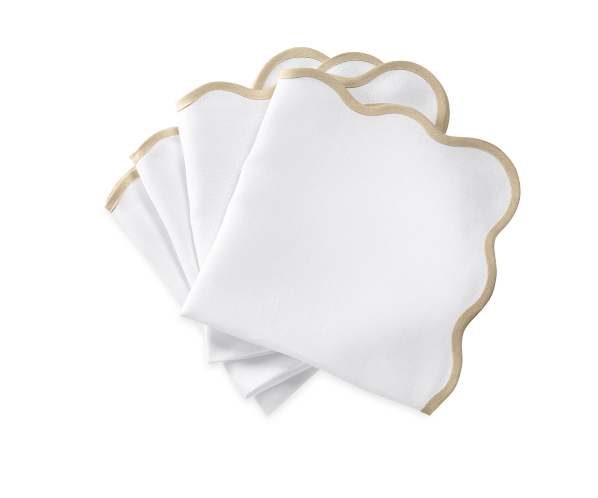Four Matouk Scallop Edge Napkins with gold borders are arranged on a white background, ideal for creating a unique tablescape or pairing with your favorite linen placemats.