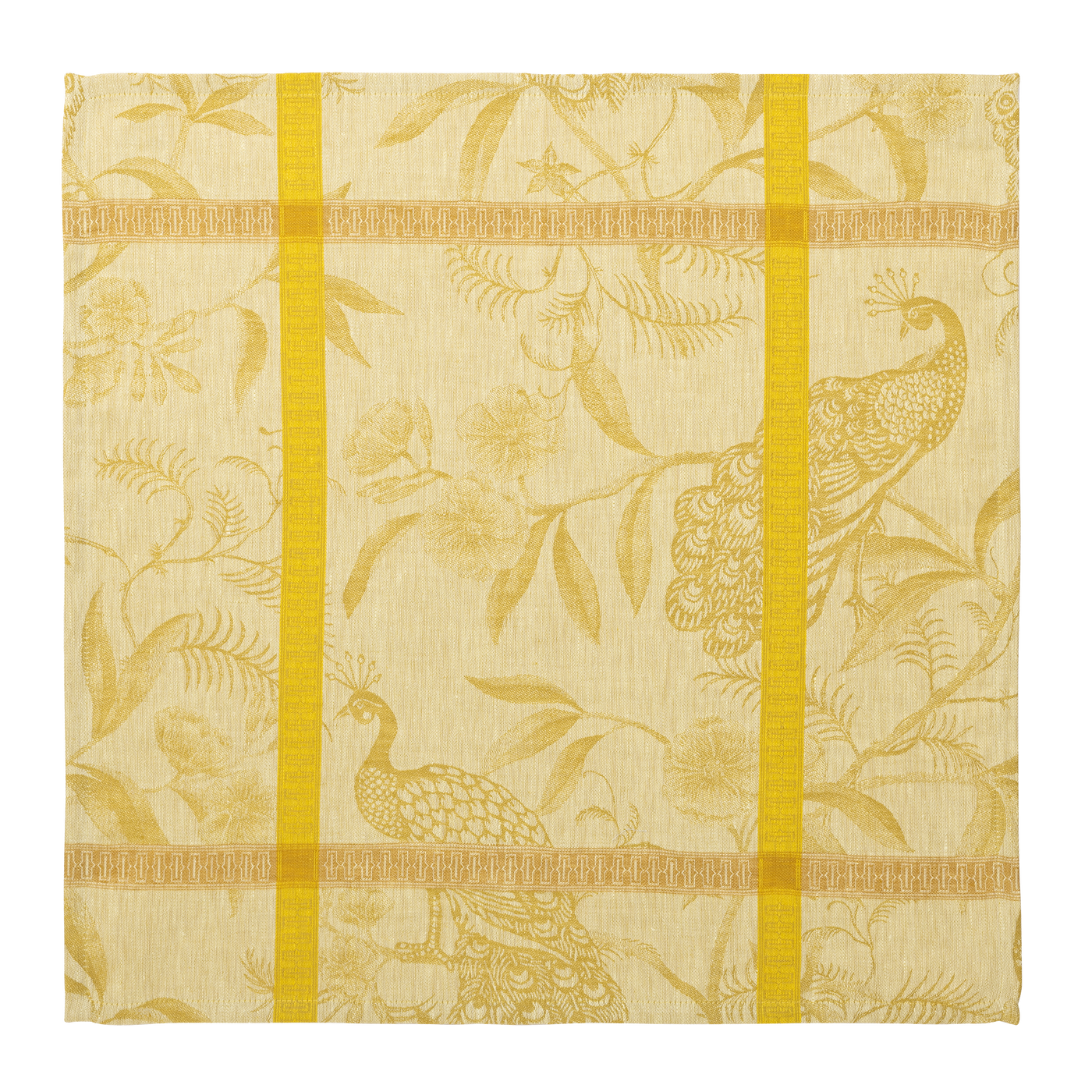 Close-up of golden jacquard napkin with woven peacock and floral motif, saffron stripe border.