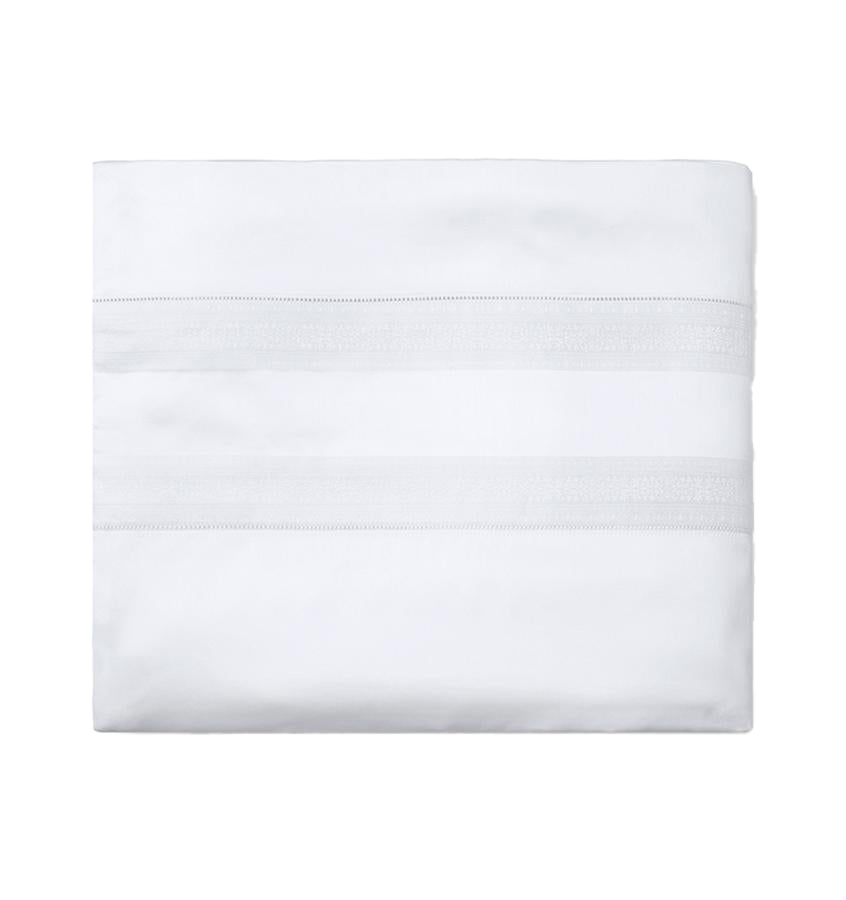 Sferra Capri duvet cover in white cotton, folded flat with woven stripe detail.