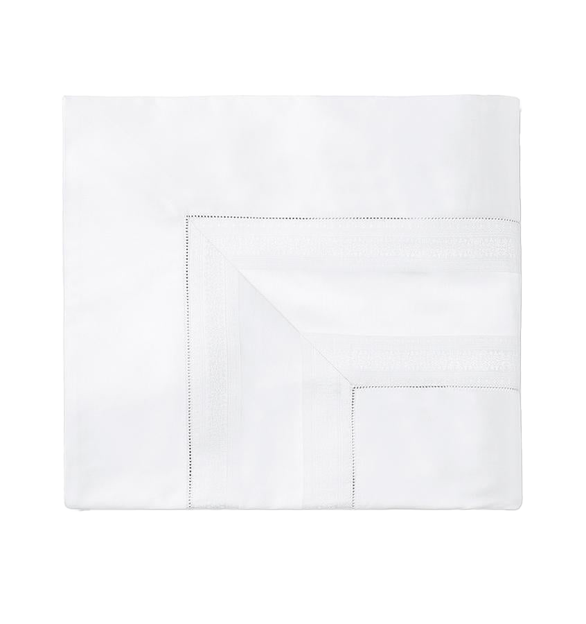 Sferra Capri white flat sheet with hemstitched border detail, folded flat.