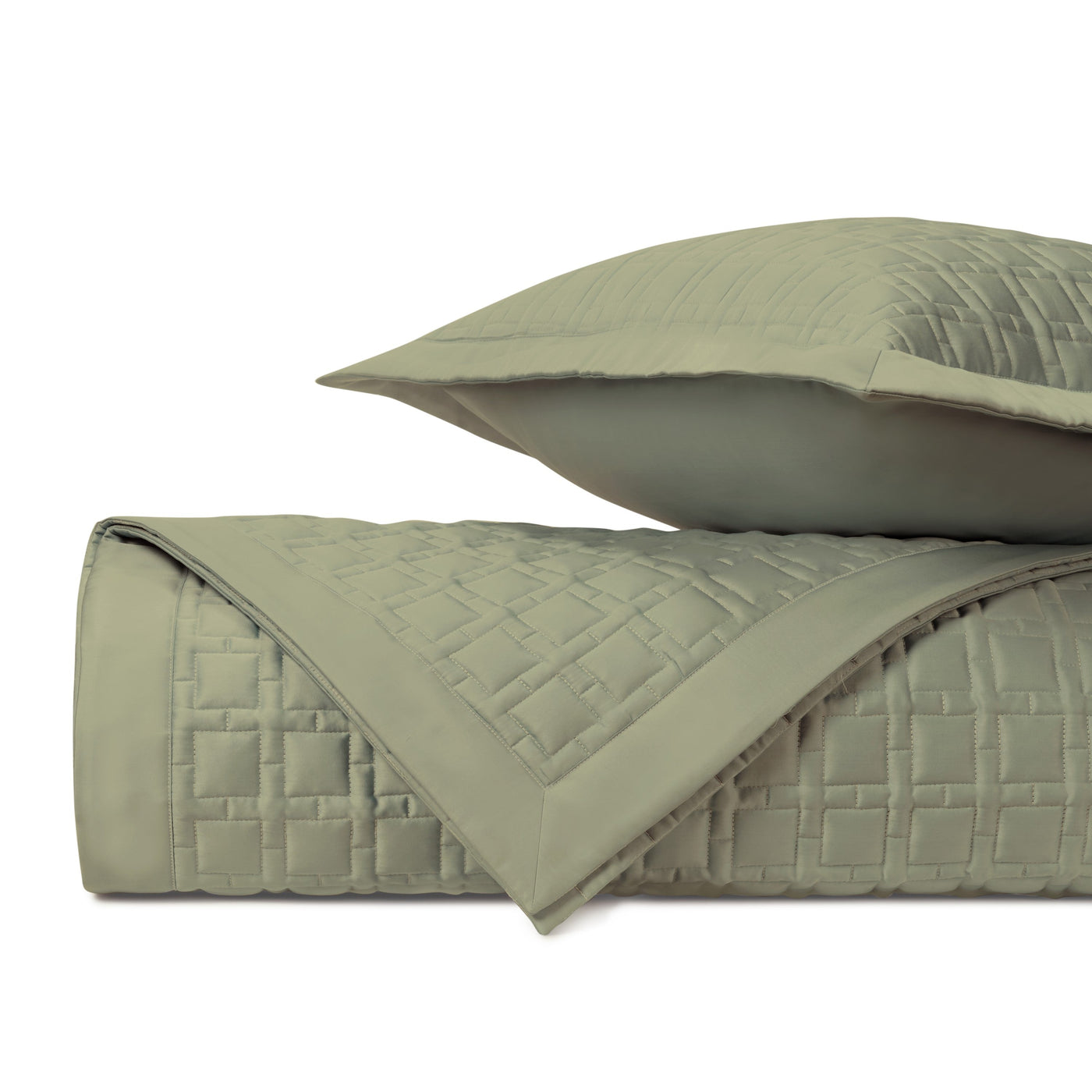 Close-up of Home Treasures Square quilted coverlet in sage, showing brick-pattern stitching detail.