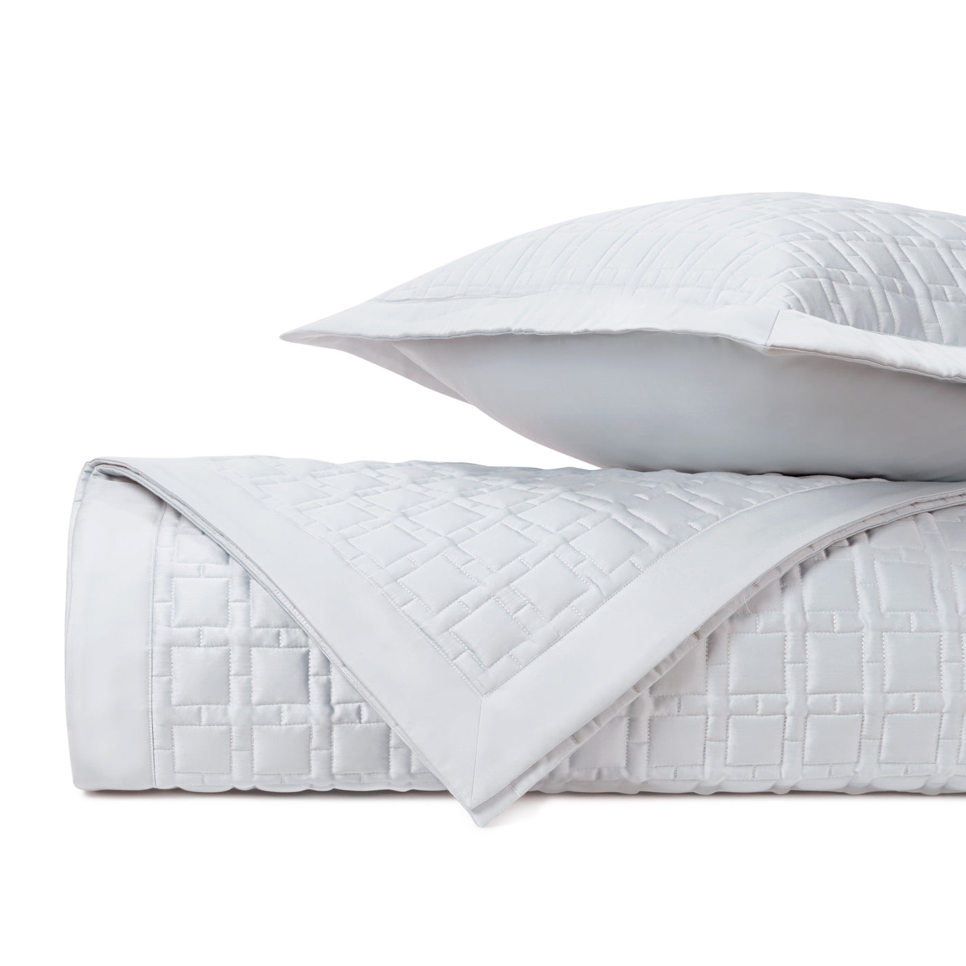 Close-up of Home Treasures Square quilted texture in white with geometric stitching detail.