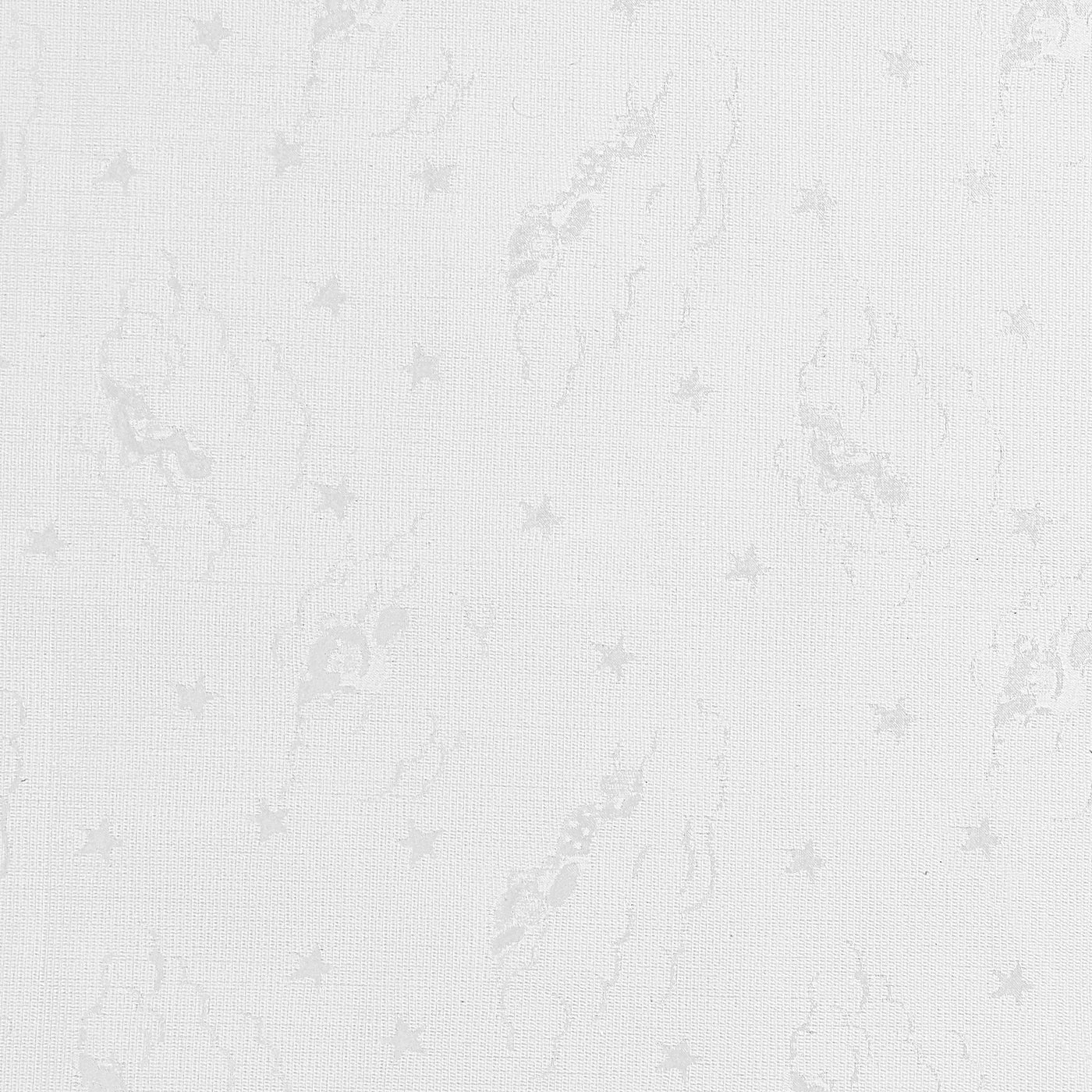 Close-up of ivory cotton jacquard weave with subtle floral and star motif.