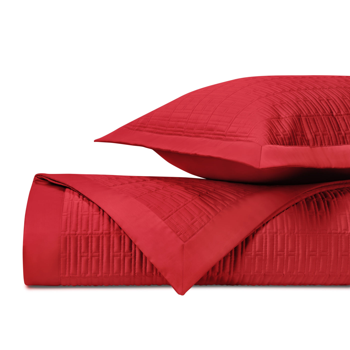 Crimson quilted coverlet and sham stacked, showing geometric grid stitching detail.