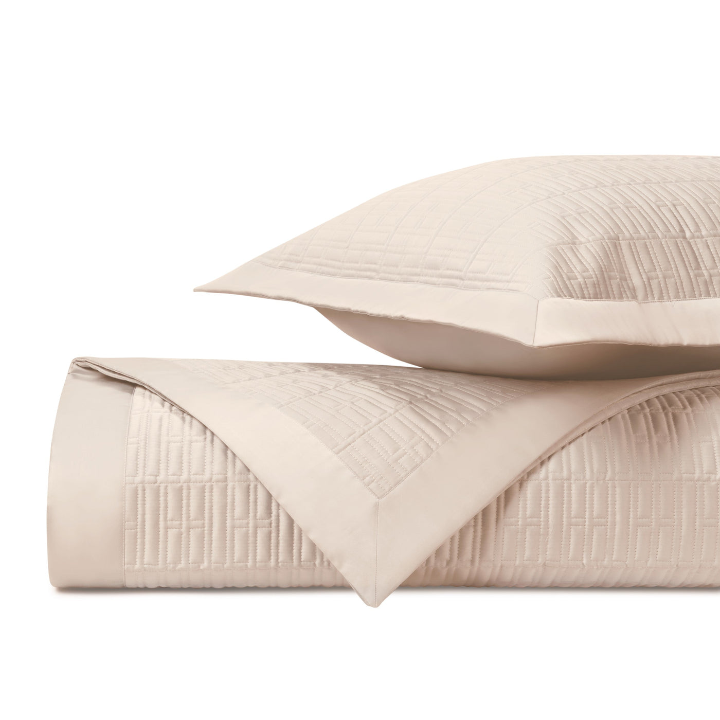 Close-up of Sydney quilted texture in ivory, showing geometric stitched grid pattern.