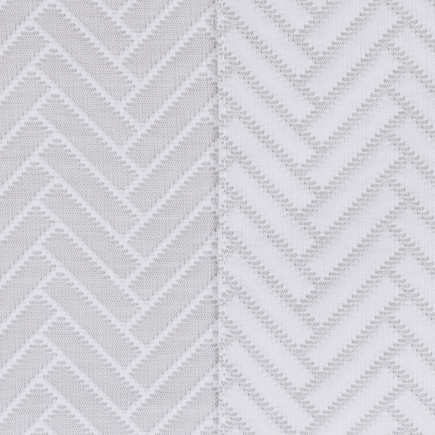 Close-up comparing two colorways of Thatcher's woven chevron texture in silver and white.