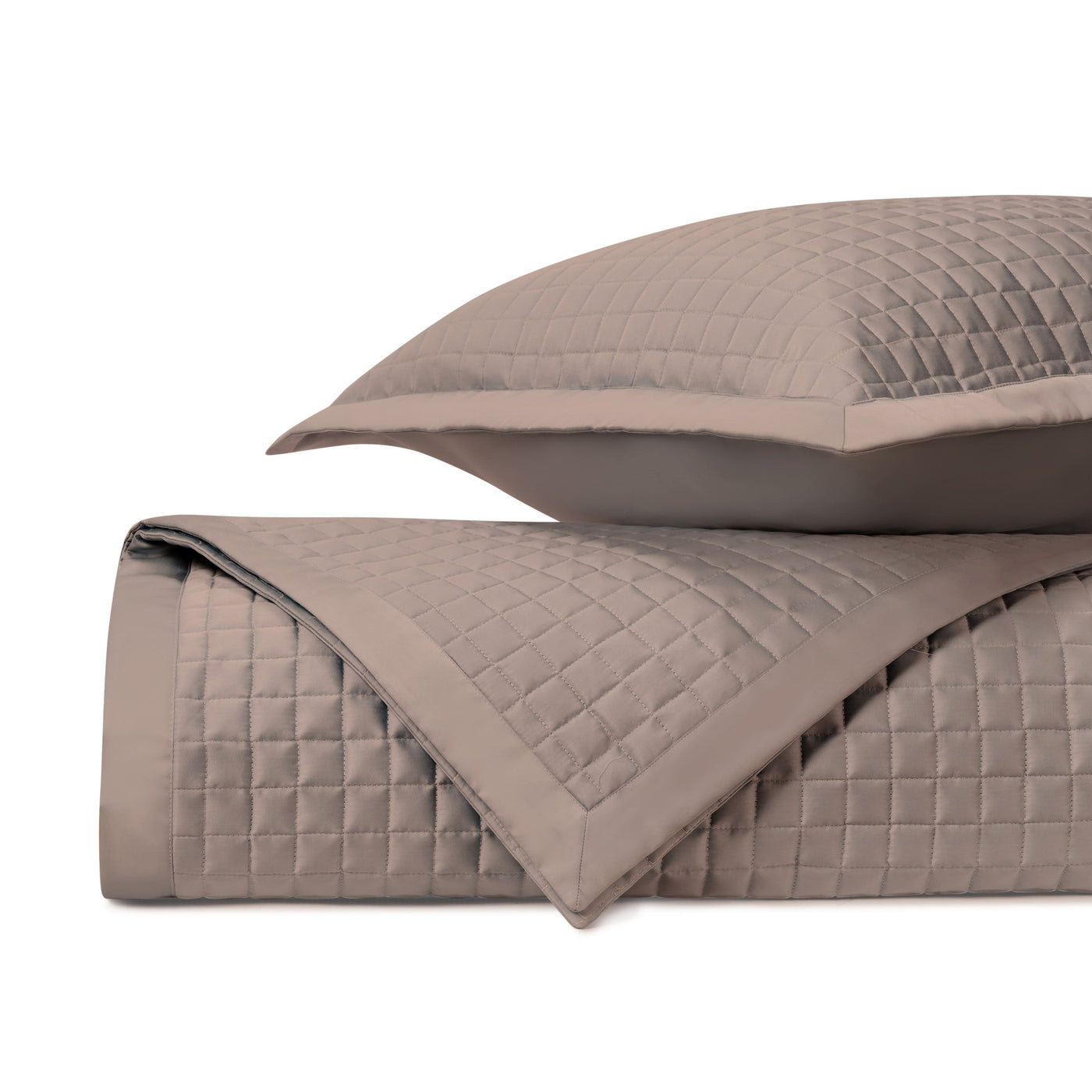 Close-up of Time Square quilted yardage in taupe, showing square grid stitching detail.