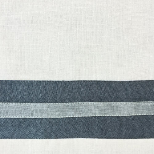 Close-up of ivory linen weave with slate and powder blue horizontal border stripes.