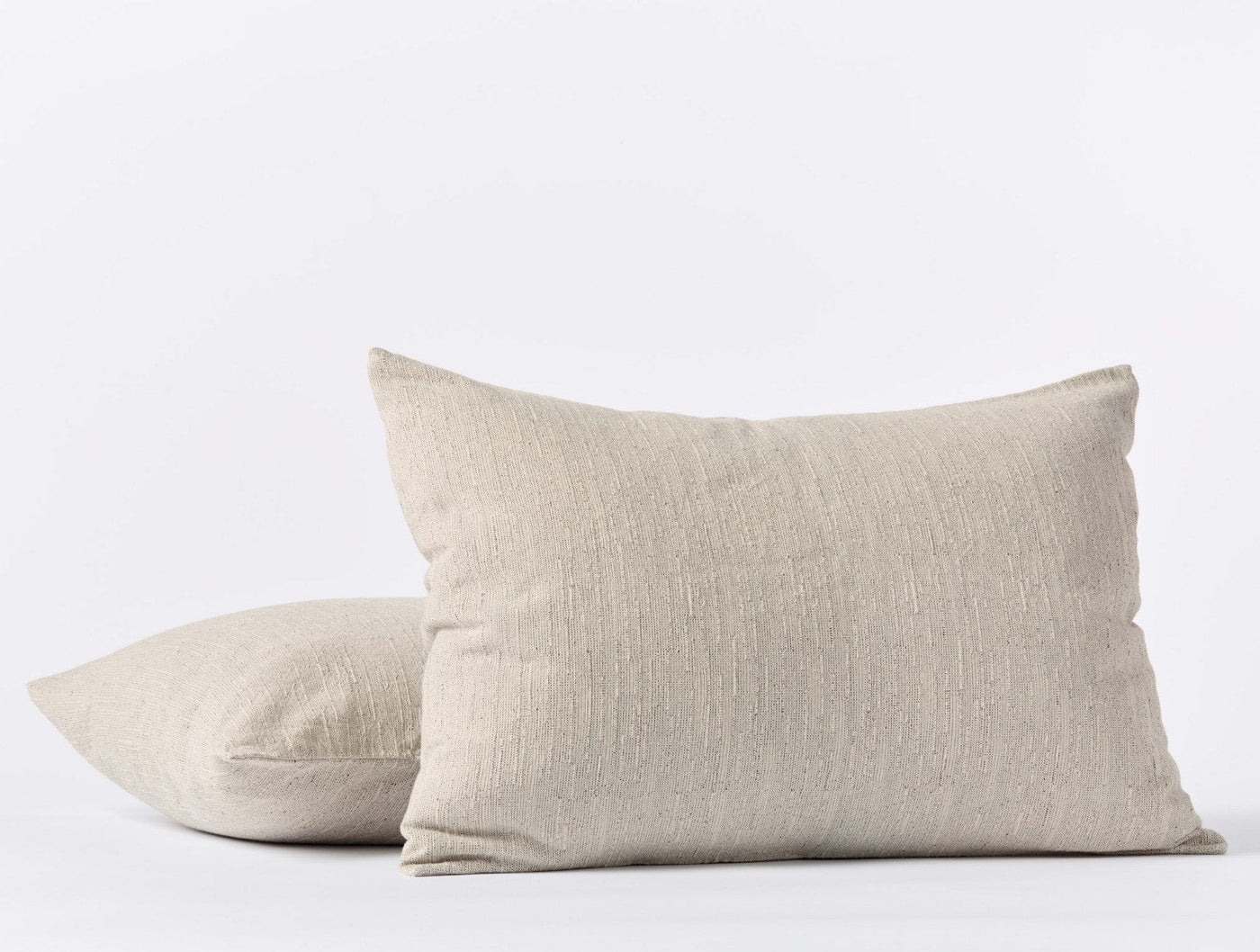 Two Coyuchi Toro Canyon shams in natural linen stacked, showing front and side views.
