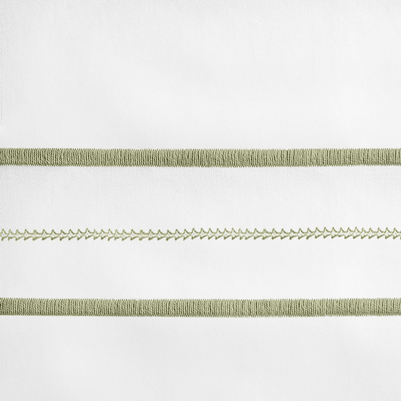 Close-up of sage embroidered border stripes on white linen, showing braid and feather-stitch detail.