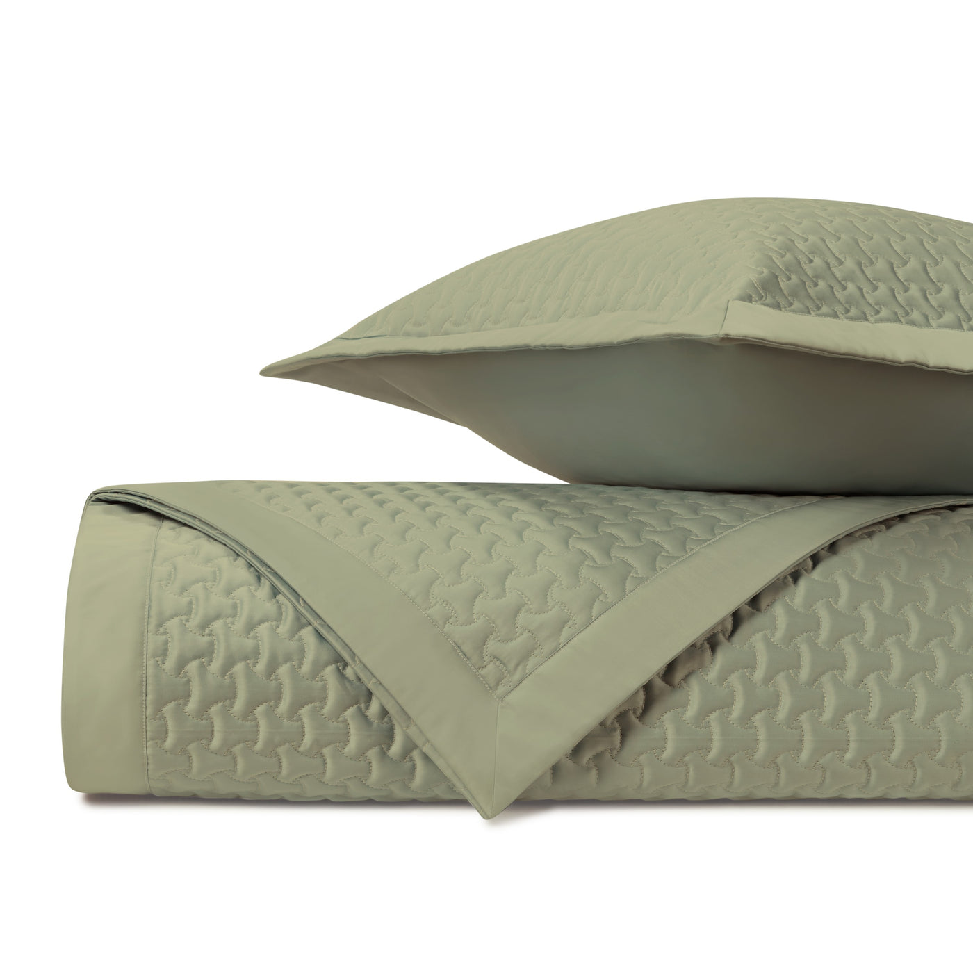 Close-up of Home Treasures Trinity quilted texture in sage green with geometric stitching pattern.