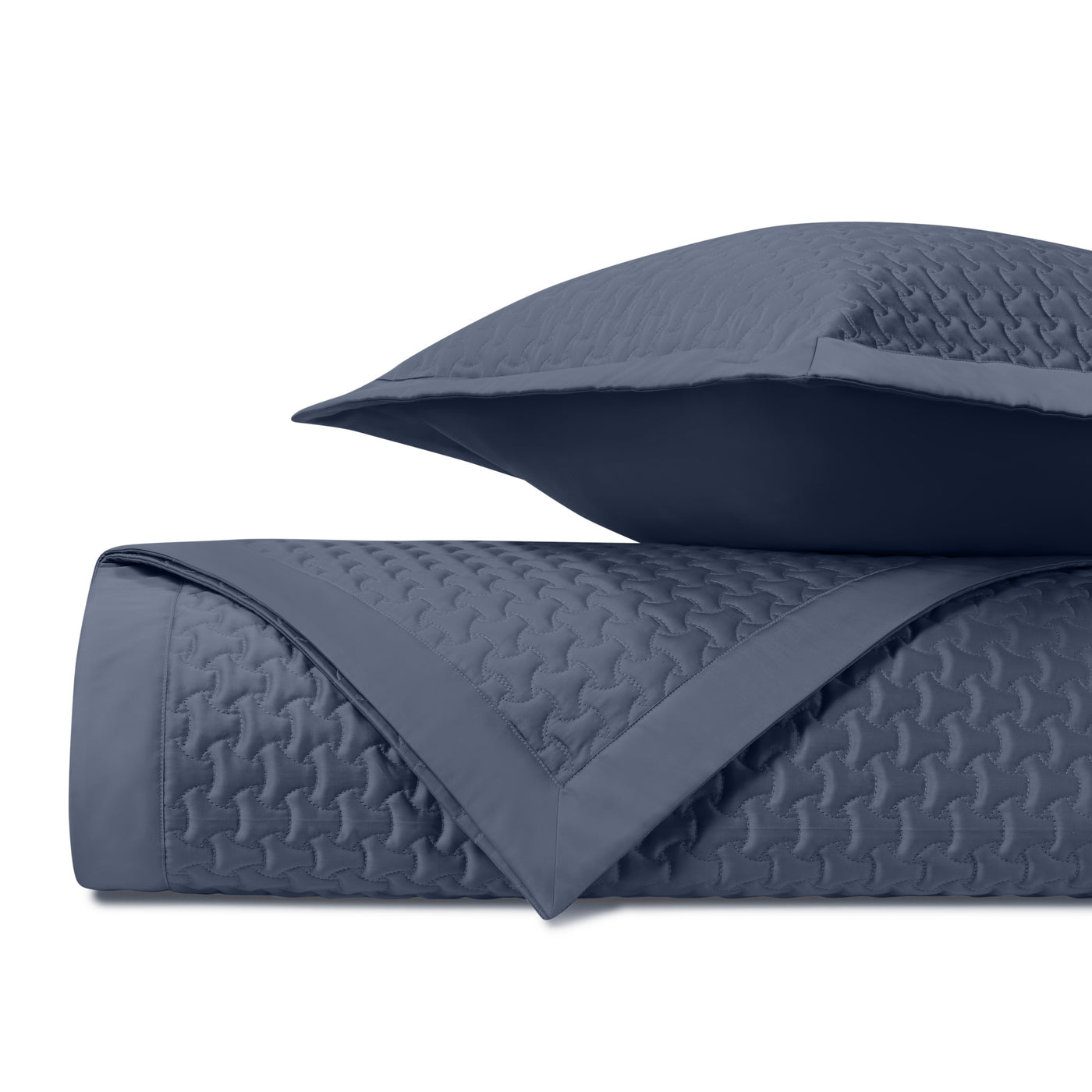 Close-up of Home Treasures Trinity quilted texture in navy blue cotton.
