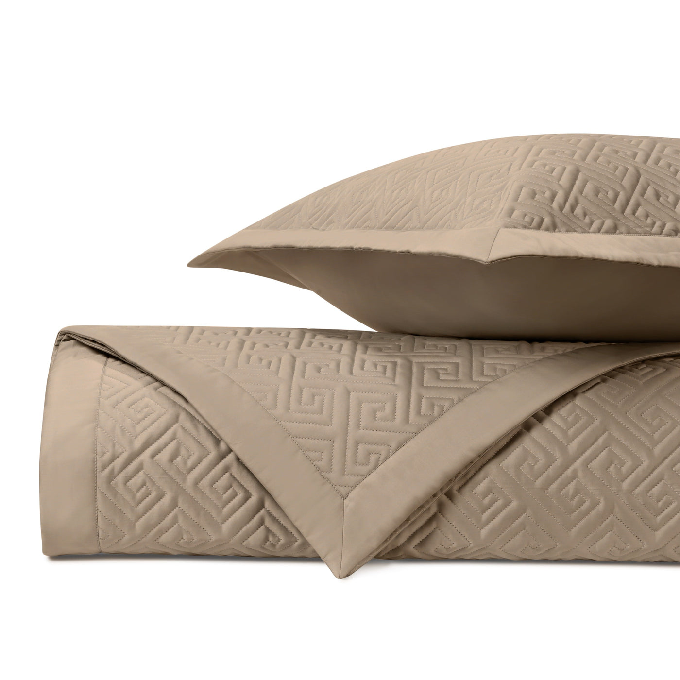 Close-up of Home Treasures Troy quilted texture in taupe with Greek key pattern.