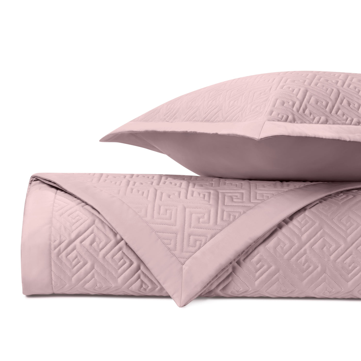 Close-up of Home Treasures Troy quilted coverlet in blush with Greek key pattern.