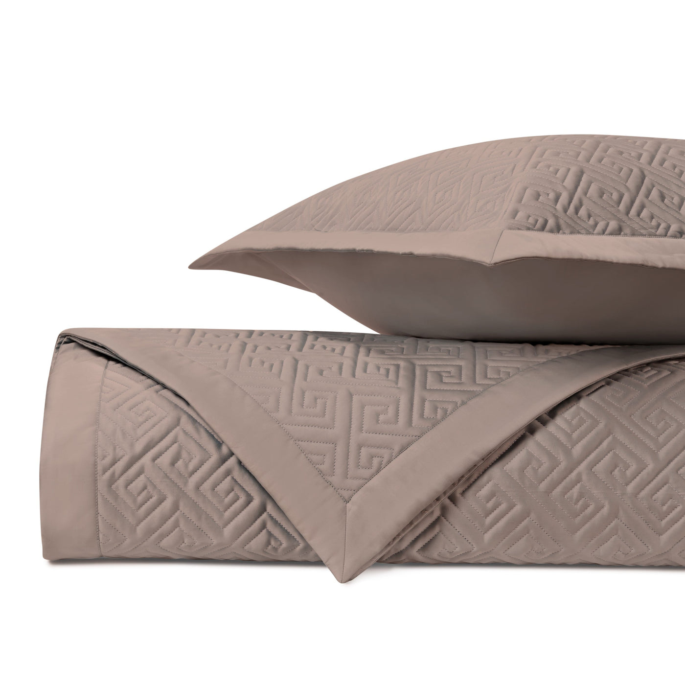 Close-up of Home Treasures Troy quilted texture in taupe with Greek key pattern.