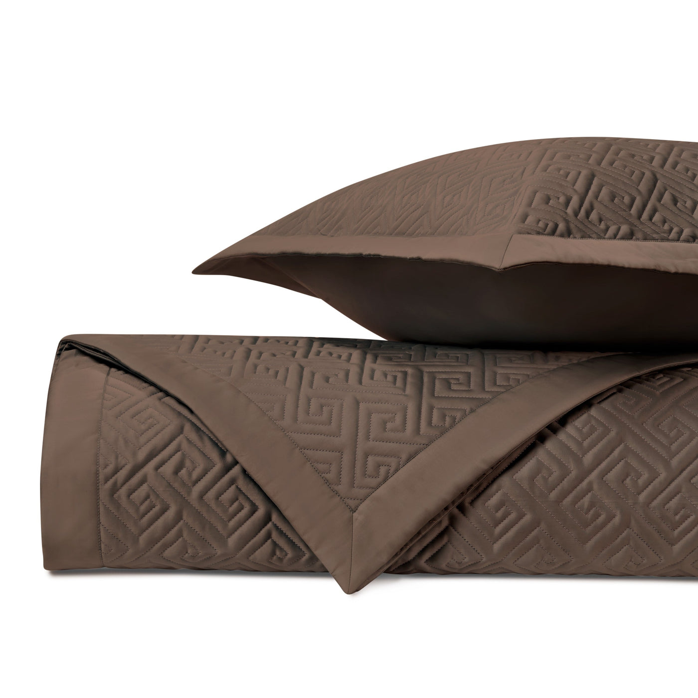 Close-up of Home Treasures Troy quilted coverlet in chocolate with Greek key pattern.