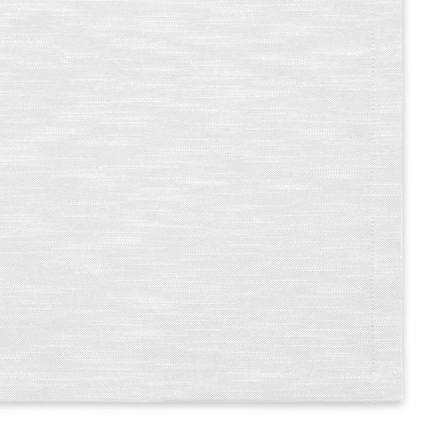 Close-up of ivory woven linen fabric showing subtle textural variation.