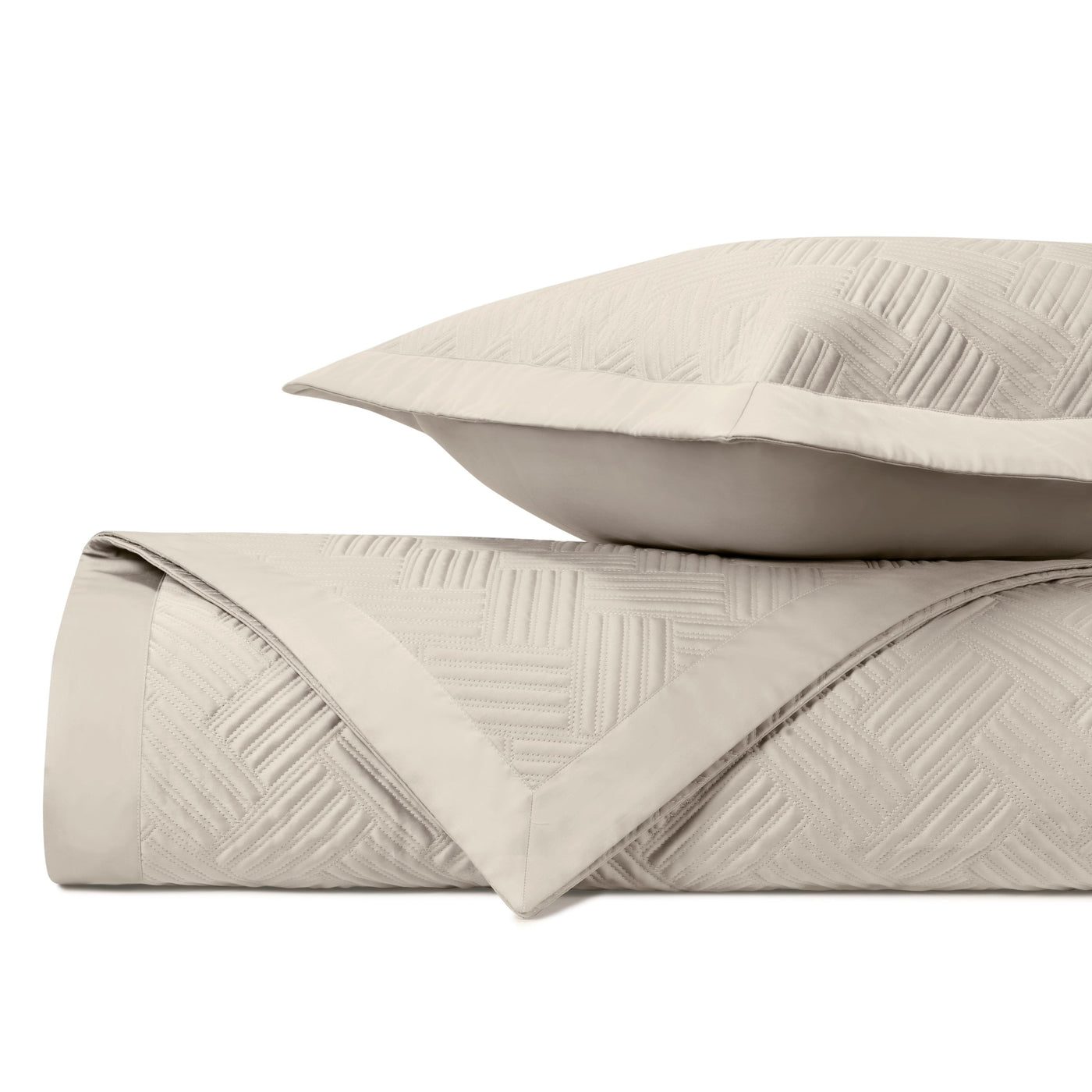 Close-up of Home Treasures Twilight quilted texture in ivory with geometric stitching detail.