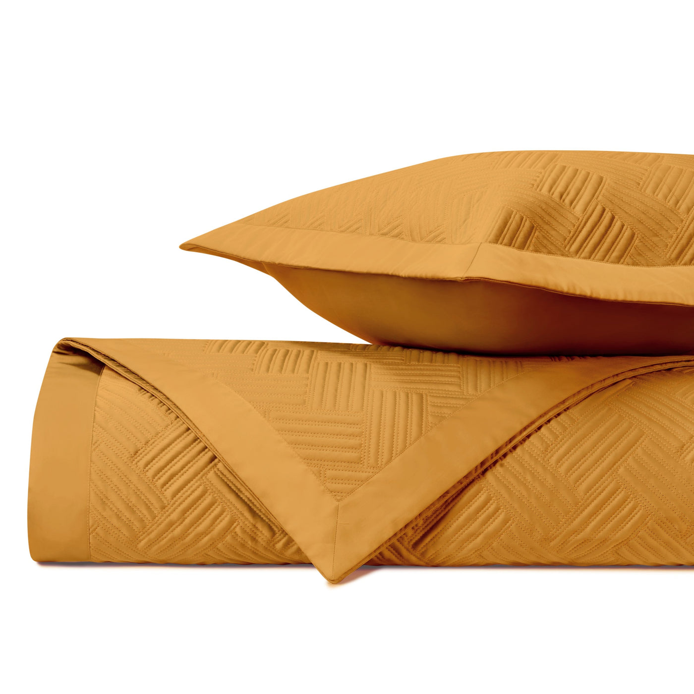 Saffron quilted cotton coverlet and sham with geometric stitched diamond pattern.