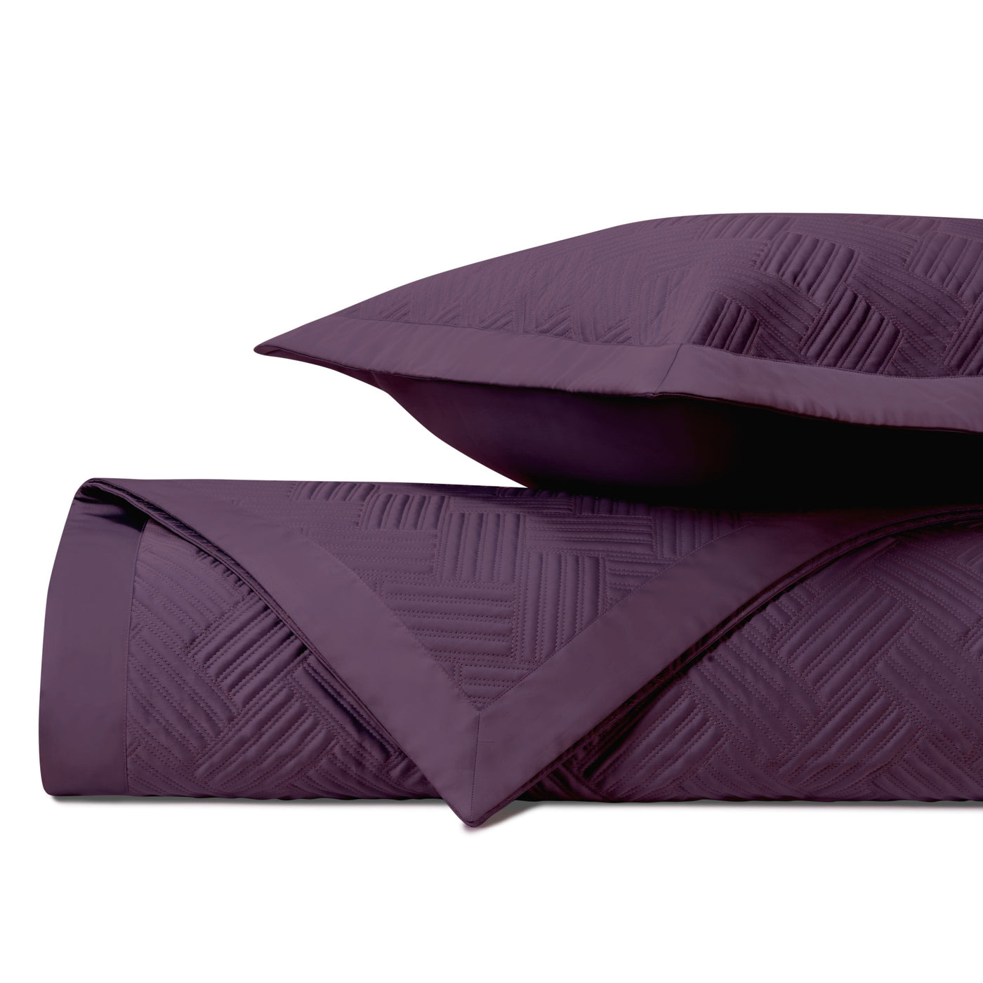 Close-up of Home Treasures Twilight quilted texture in deep plum with geometric basketweave pattern.