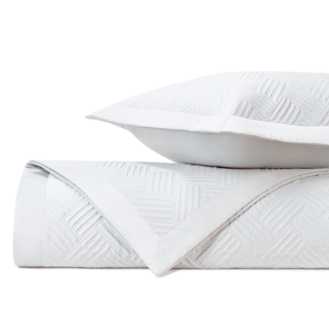 Close-up of Home Treasures Twilight white quilted texture with geometric diamond stitching.