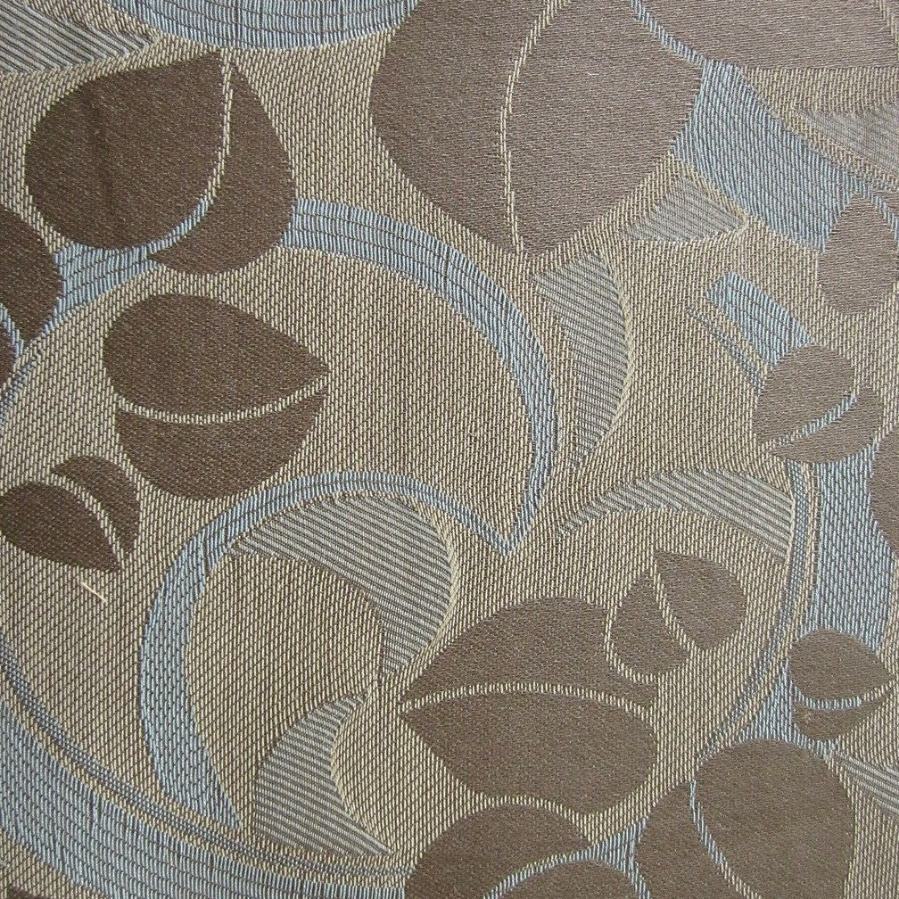 Close-up of woven leaf jacquard pattern in taupe and powder blue on Valentene sham.