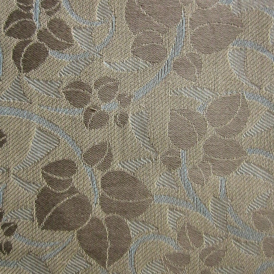 Close-up of Home Treasures Valentene woven floral leaf jacquard in taupe and sky blue.
