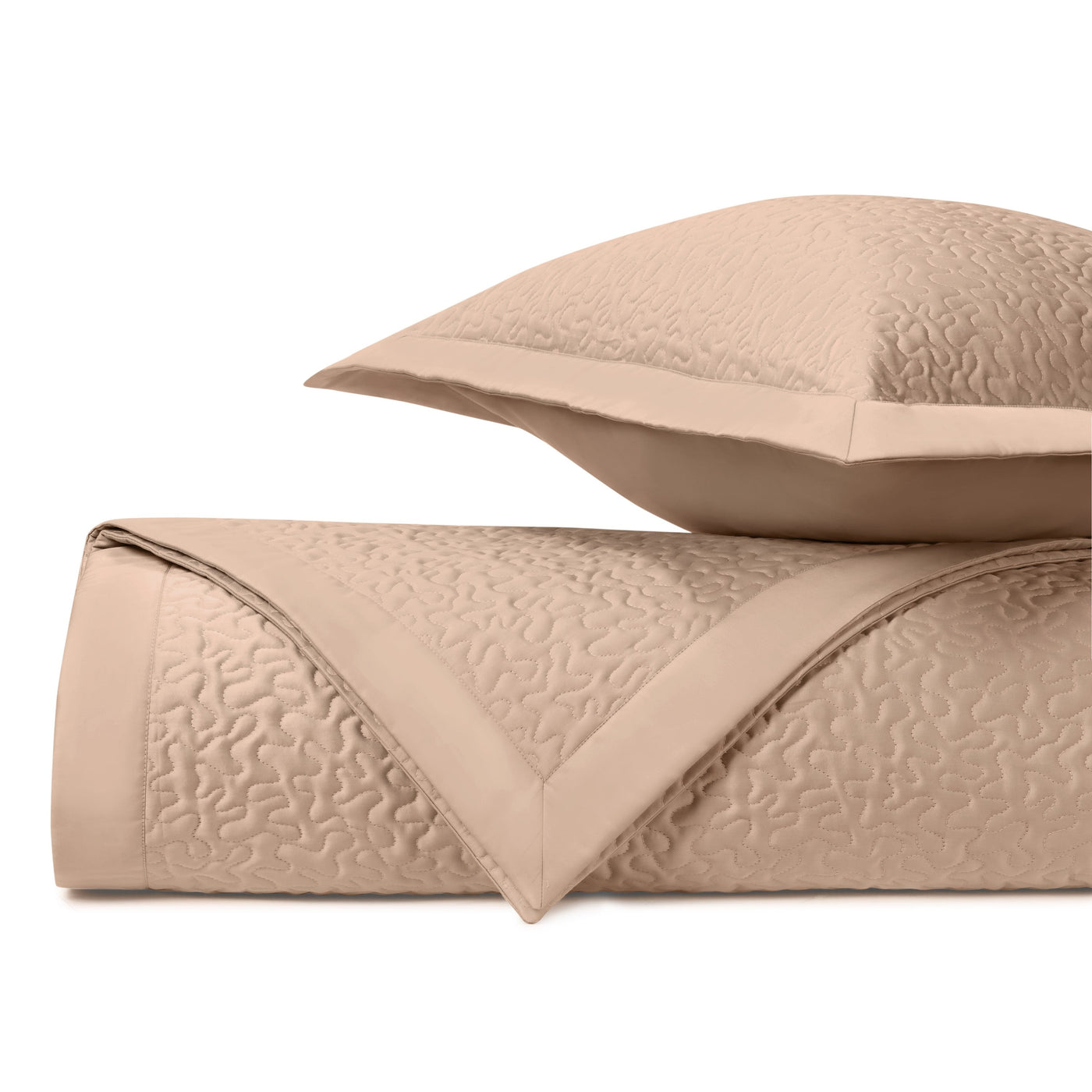 Close-up of Home Treasures Vermicelli quilted texture in warm camel tone.