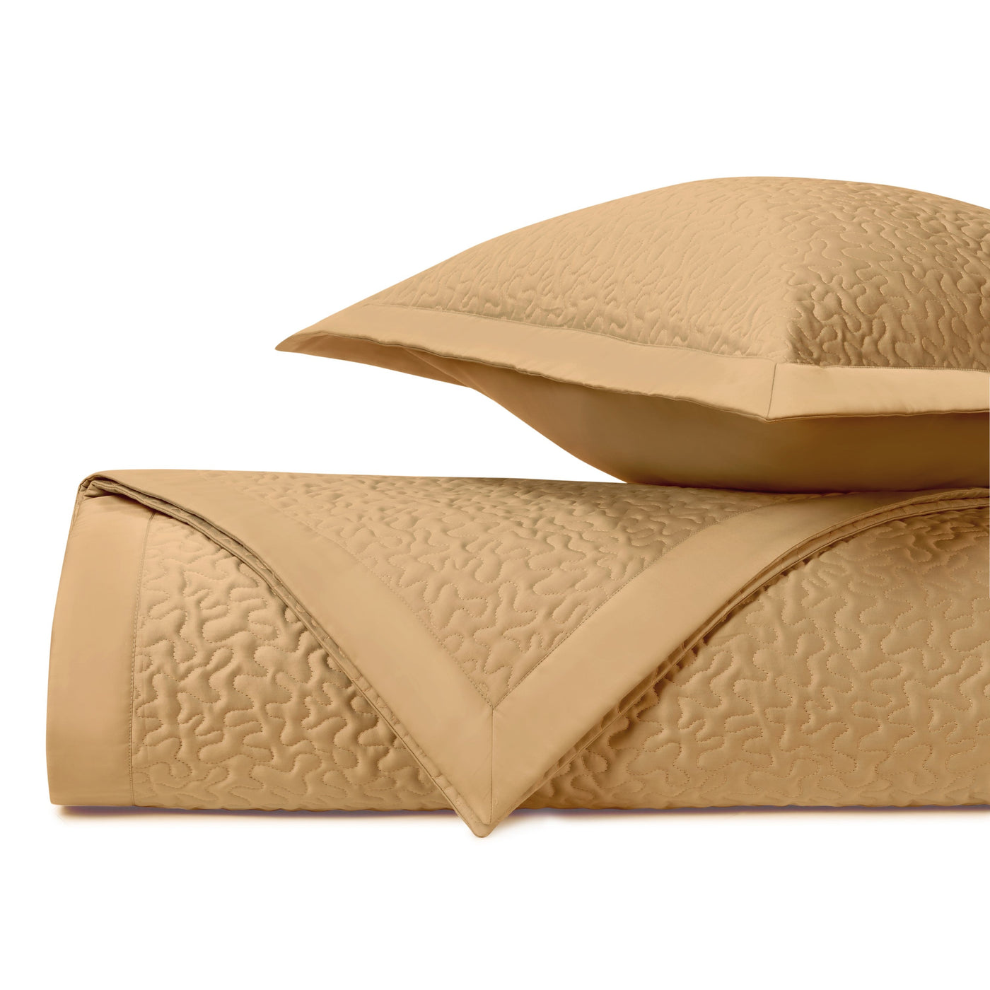 Close-up of Home Treasures Vermicelli quilted texture in caramel with subtle wave stitching.