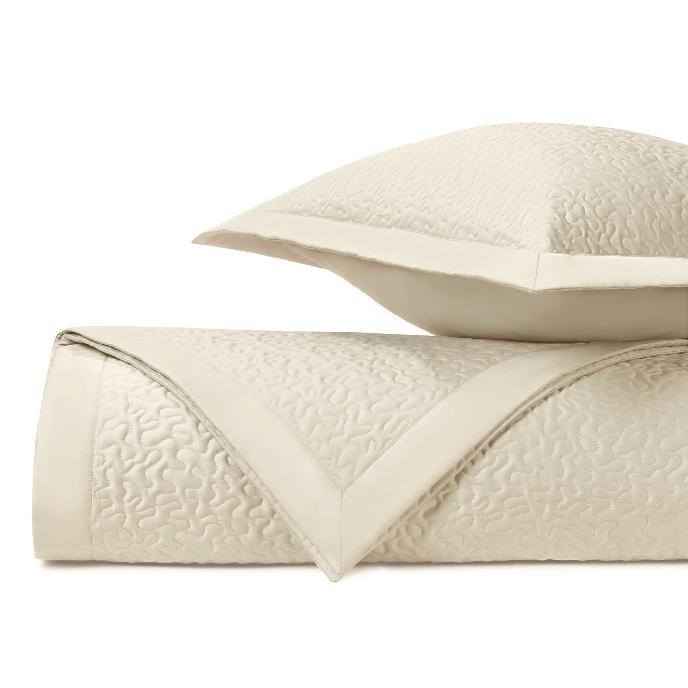 Close-up of Home Treasures Vermicelli ivory quilted texture with tonal floral stitching detail.