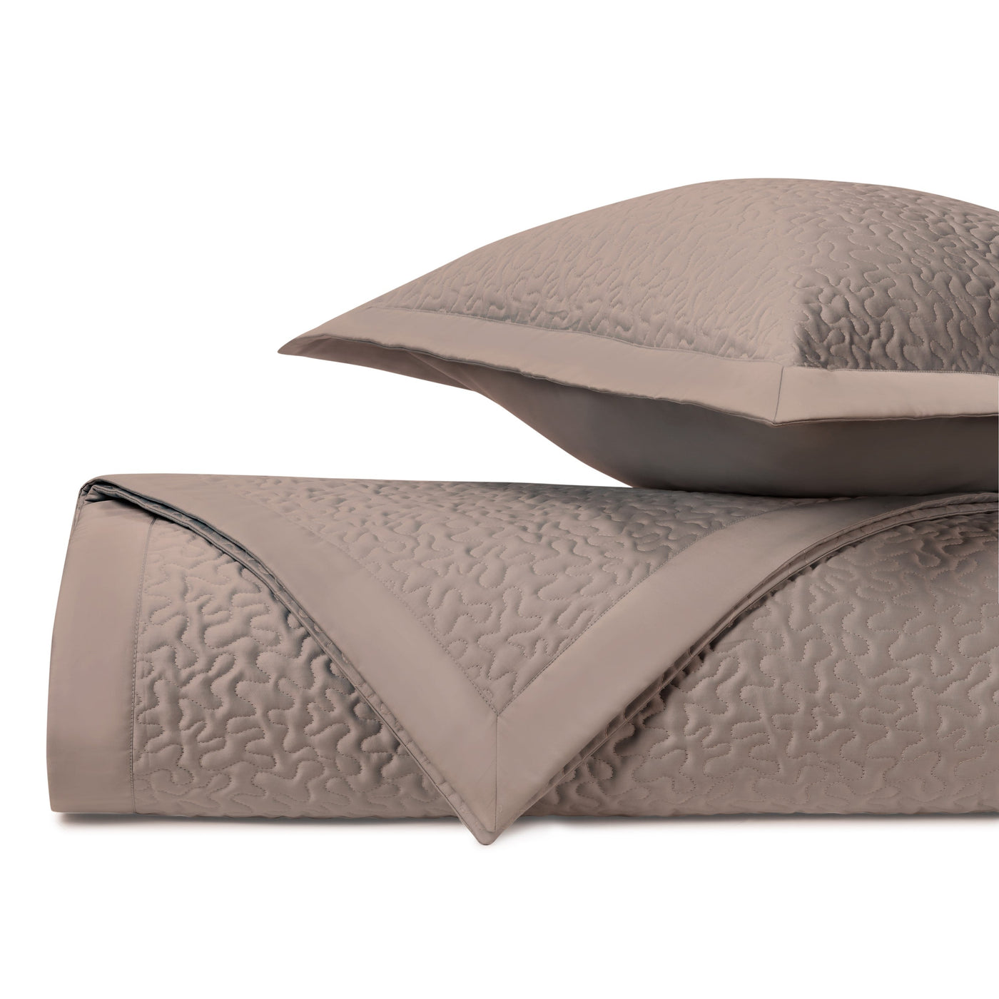 Close-up of Home Treasures Vermicelli quilted texture in taupe with trim detail.