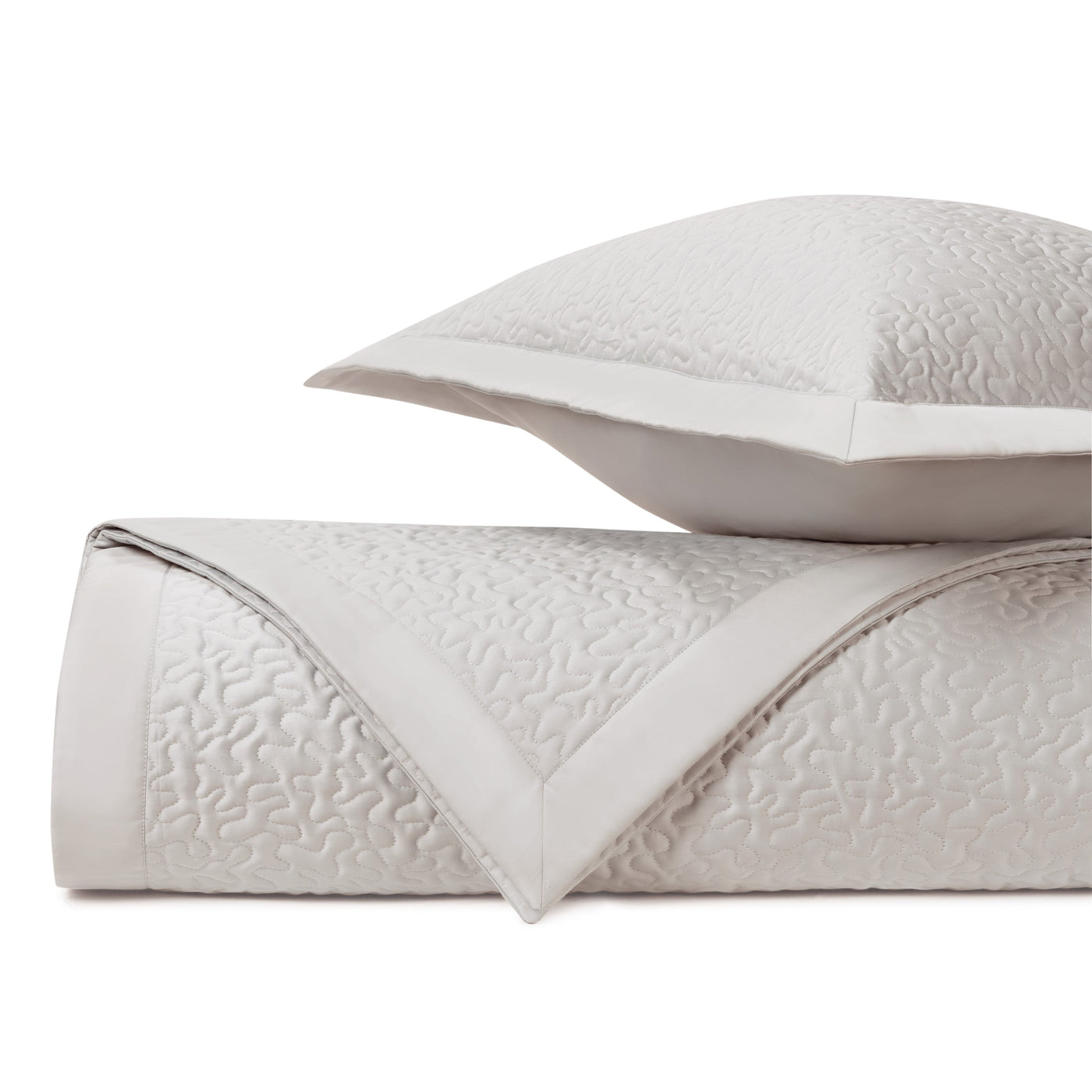 Close-up of Home Treasures Vermicelli quilted texture in ivory with tonal stitching detail.