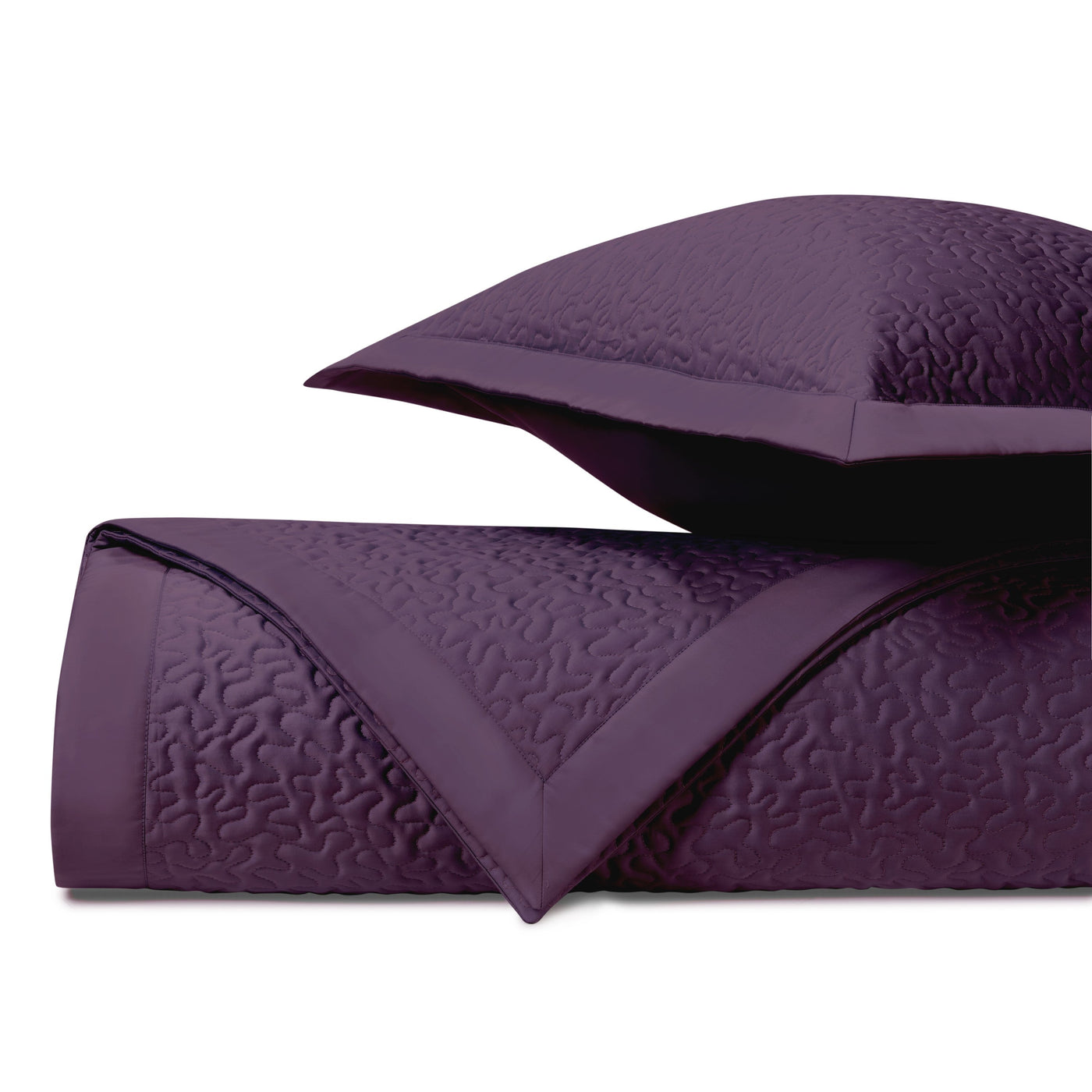 Close-up of Home Treasures Vermicelli quilted texture in deep plum with matching sham.