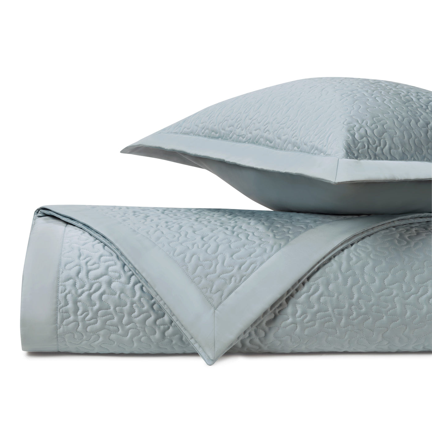 Close-up of Home Treasures Vermicelli quilted texture in pale mist blue cotton.