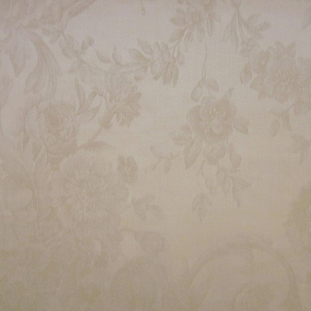 Close-up of ivory jacquard fabric with tone-on-tone floral and vine pattern.