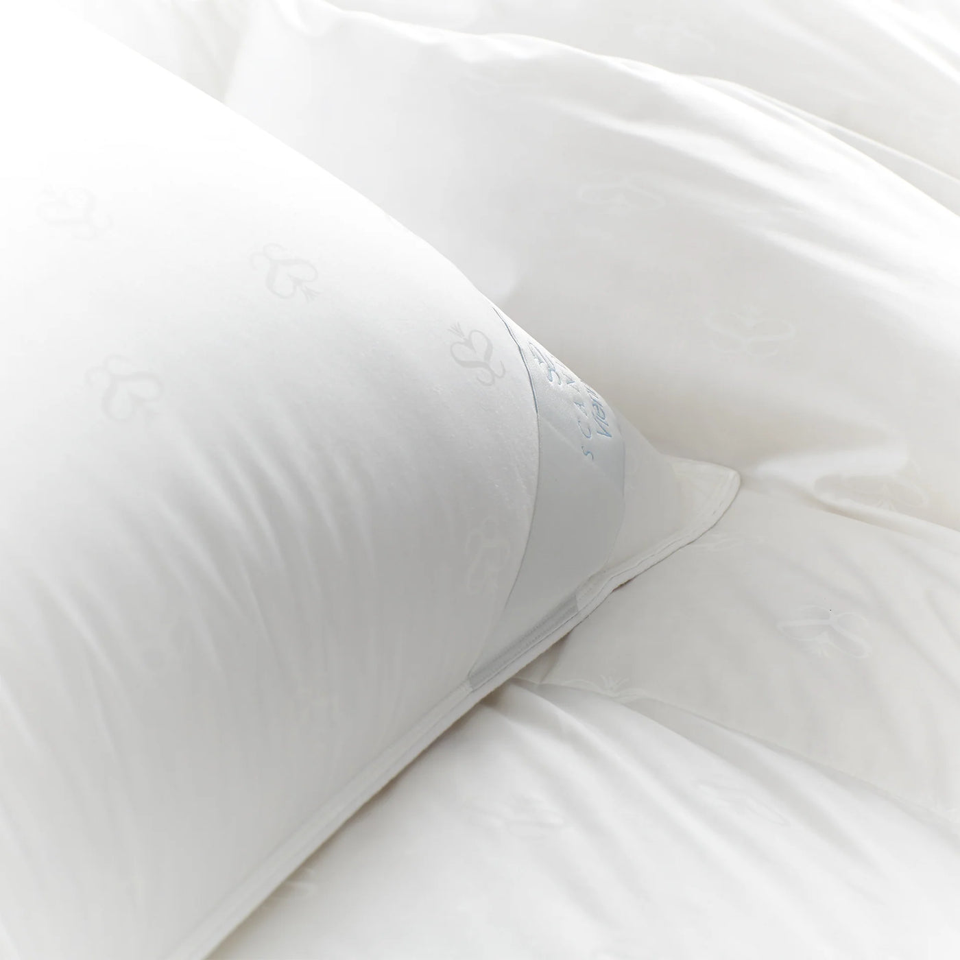 Close-up of Scandia Home Vienna duvet in white, showing tone-on-tone woven pattern detail.