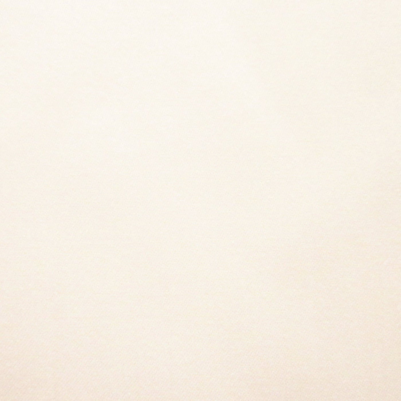 Close-up of ivory cotton fabric showing smooth, fine weave texture.