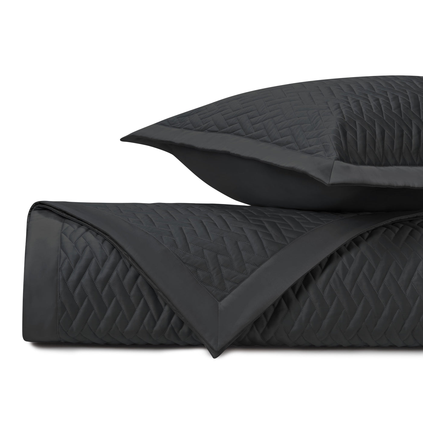 Close-up of Home Treasures Viscaya quilted texture in black with diamond pattern.