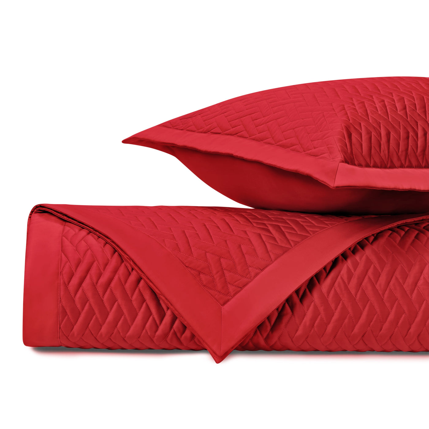 Close-up of Home Treasures Viscaya quilted coverlet in crimson with woven diamond stitching.