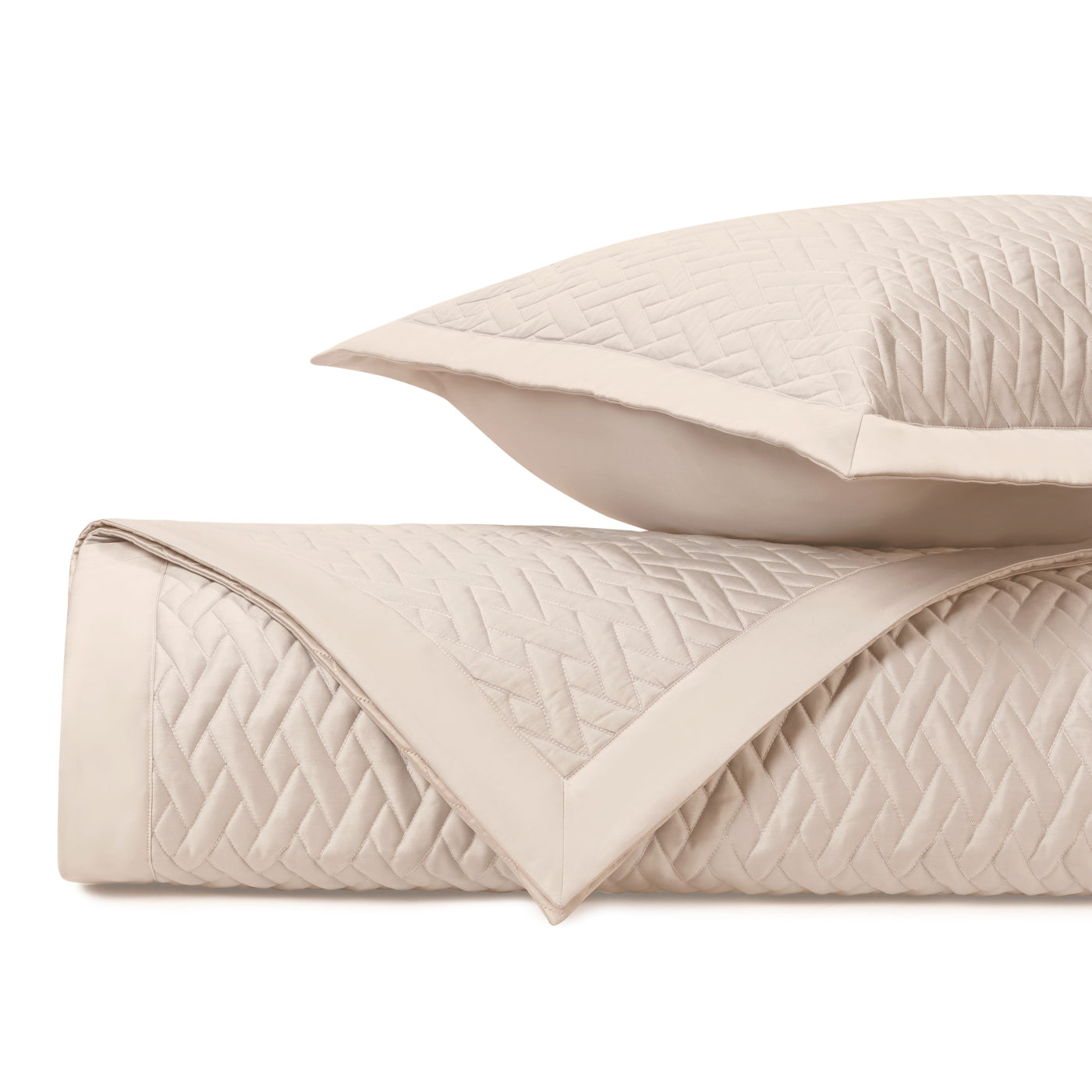 Close-up of Home Treasures Viscaya quilted texture in ivory with diamond weave pattern.