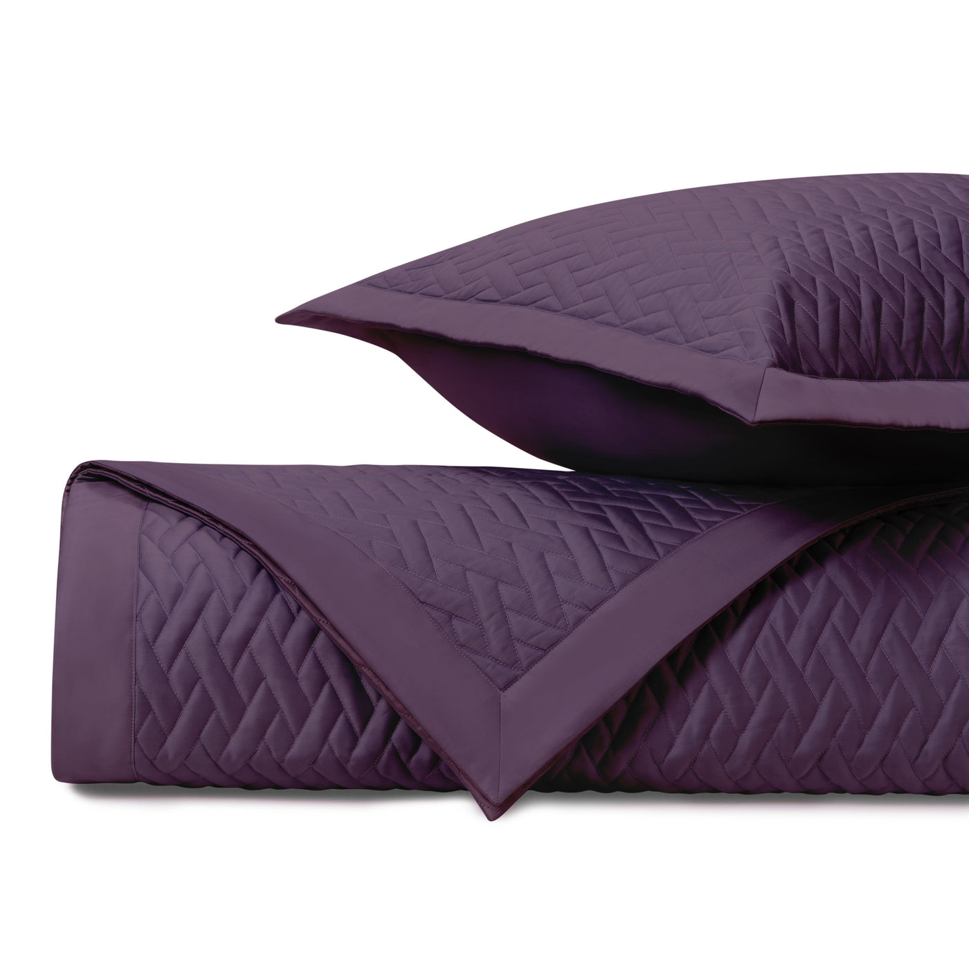 Close-up of Home Treasures Viscaya quilted coverlet in deep plum with diamond stitching.
