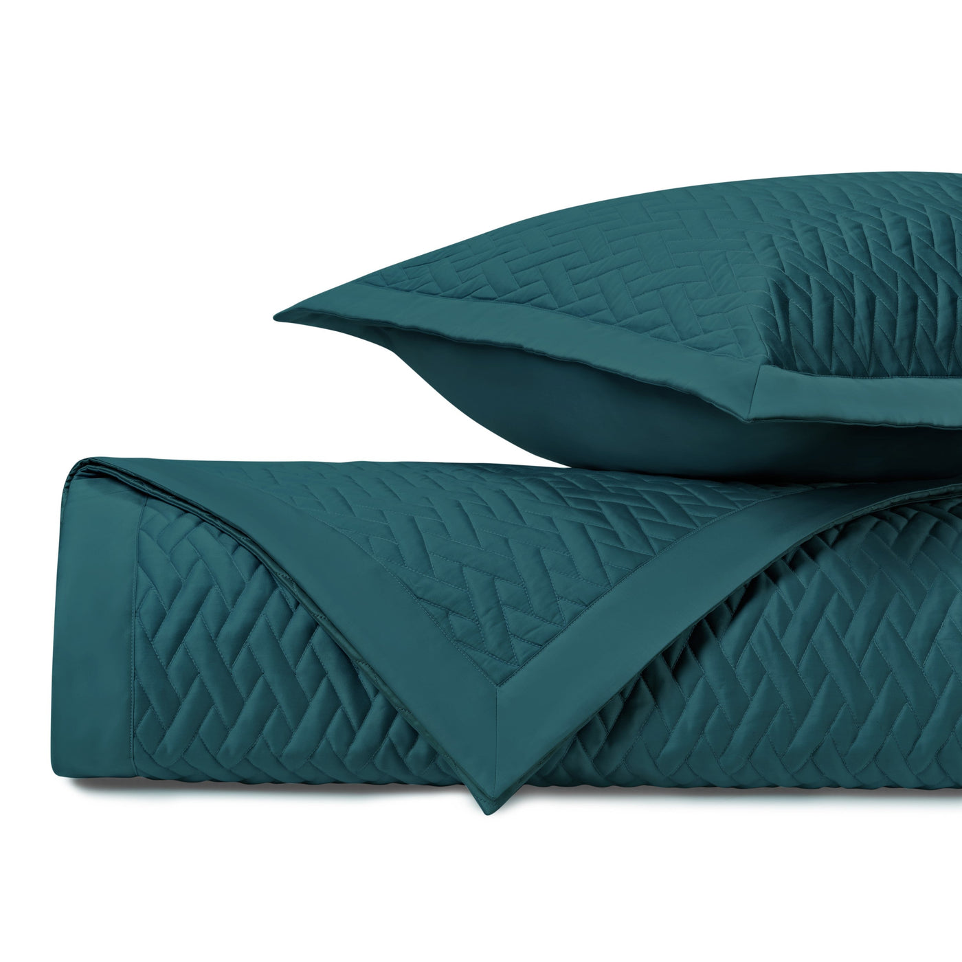 Close-up of Home Treasures Viscaya quilted texture in teal with geometric diamond stitching.