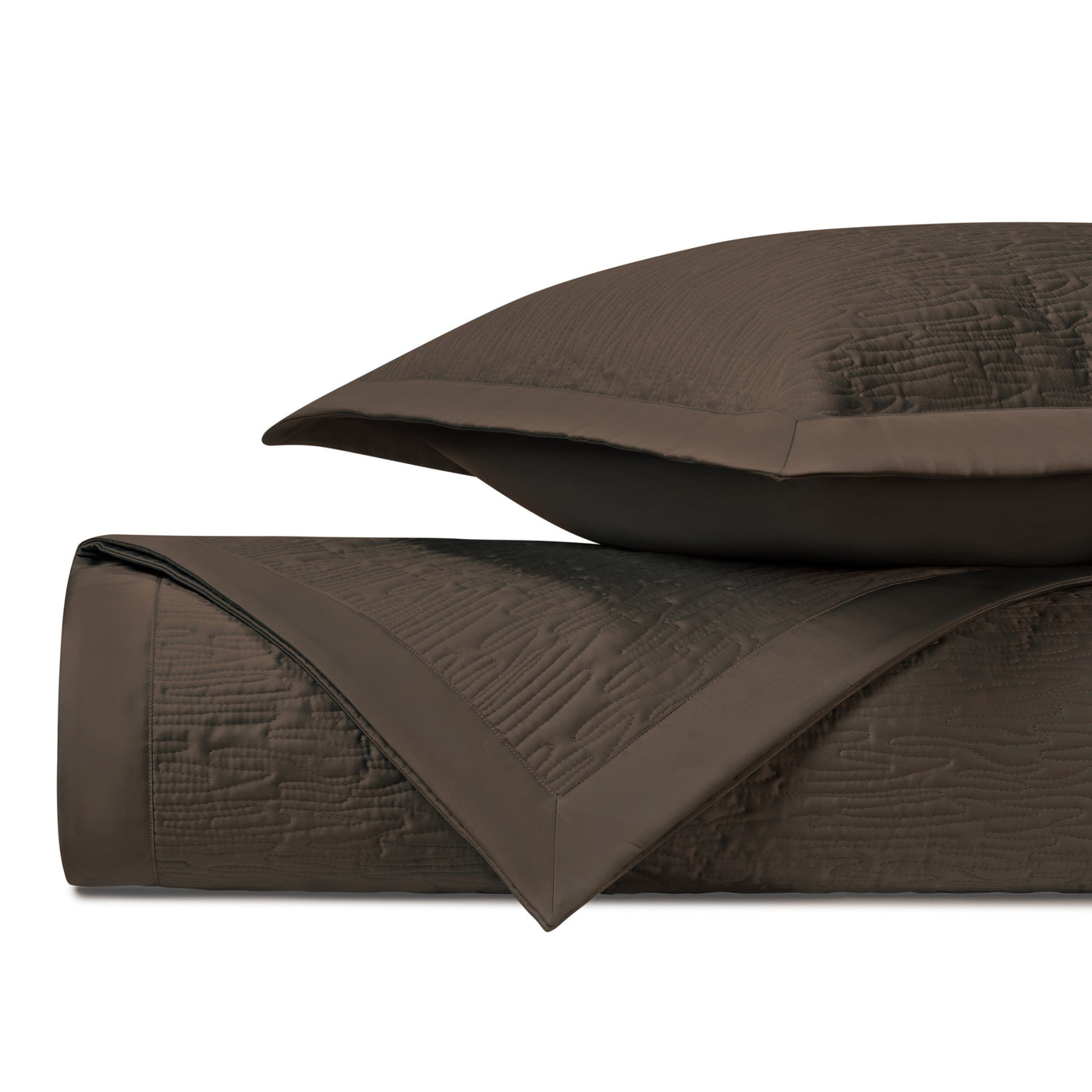 Close-up of Home Treasures Wave quilted yardage in rich chocolate with textured stitching detail.
