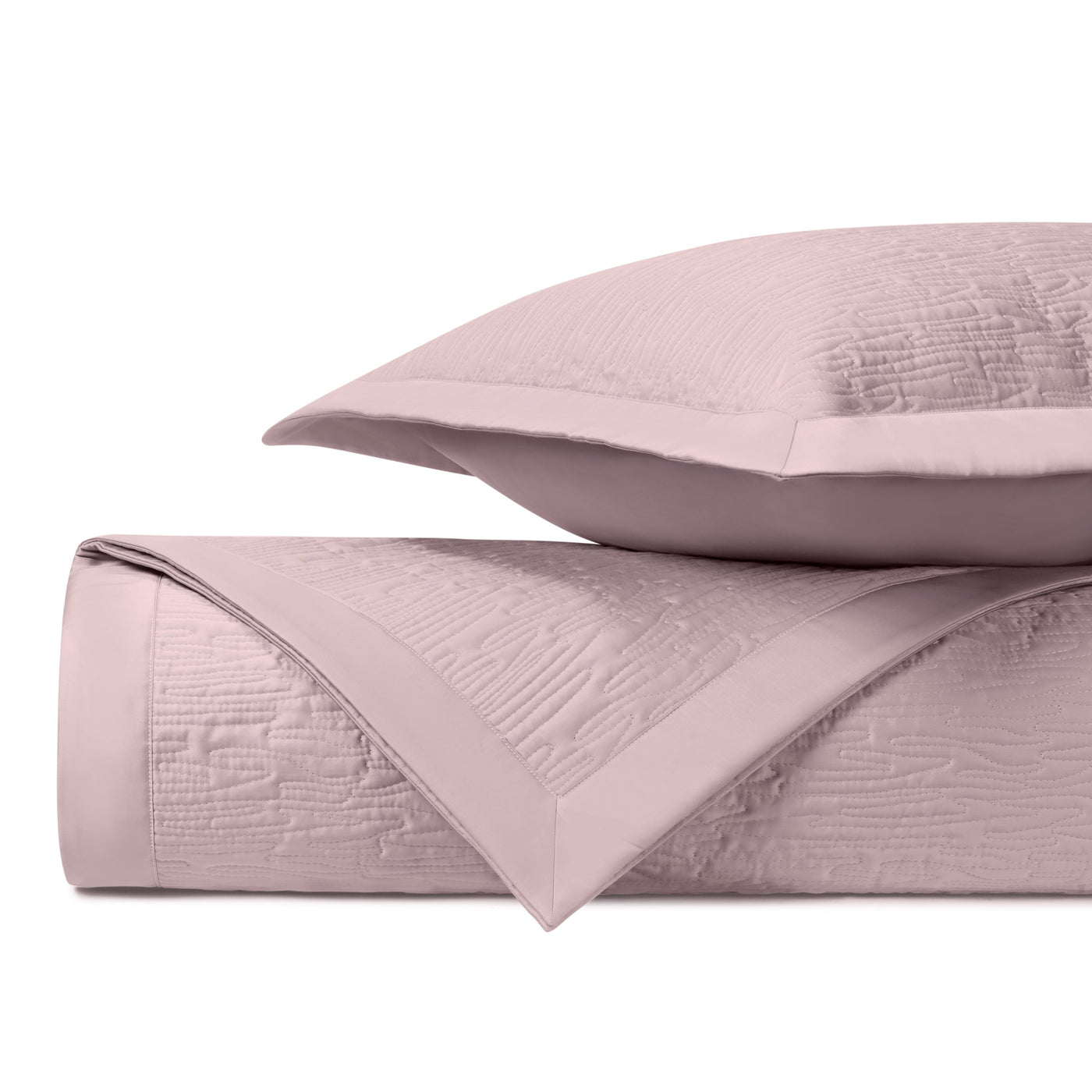 Close-up of Home Treasures Wave quilted yardage in blush with textured matelassé weave detail.