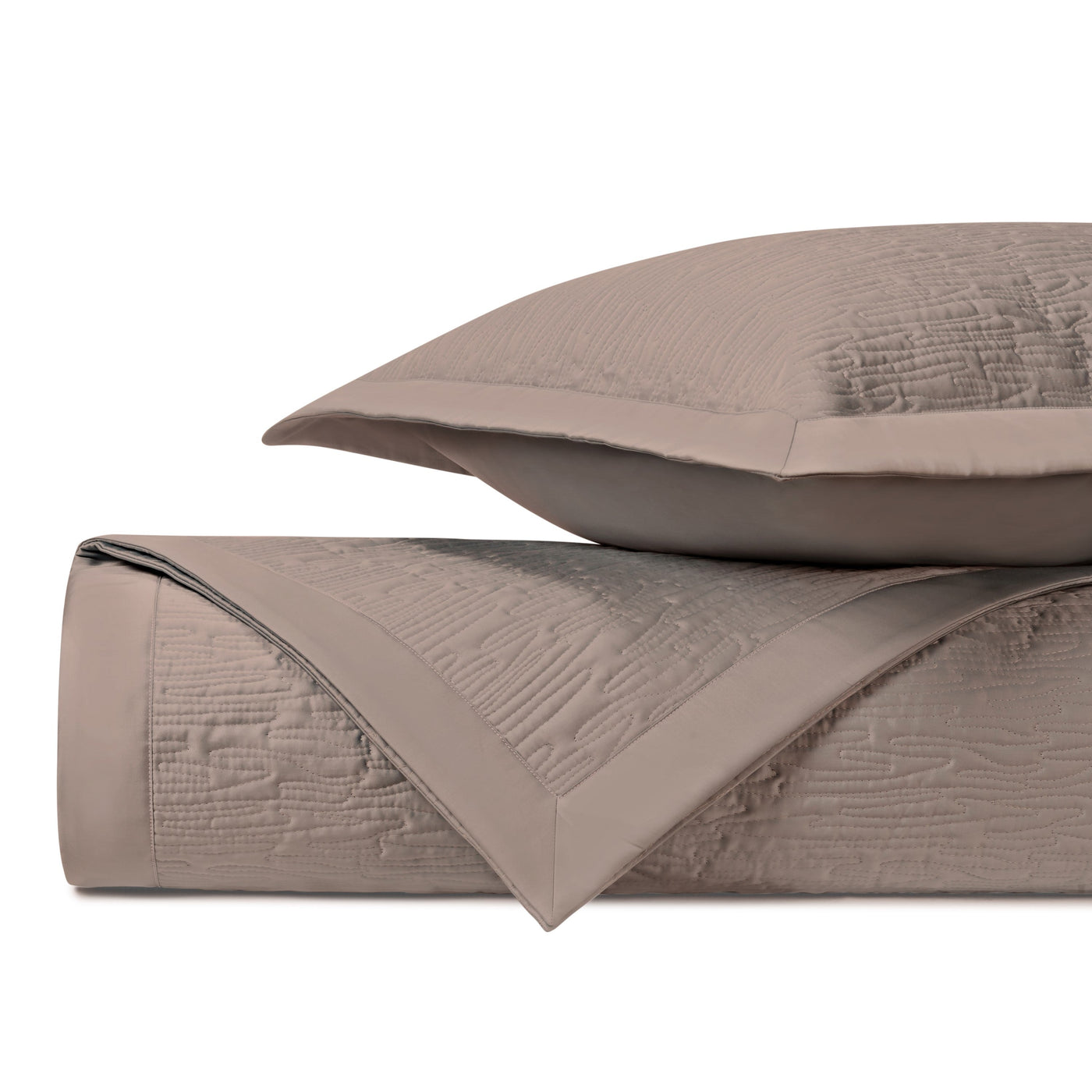 Close-up of Home Treasures Wave quilted yardage in taupe with textured matelassé weave detail.