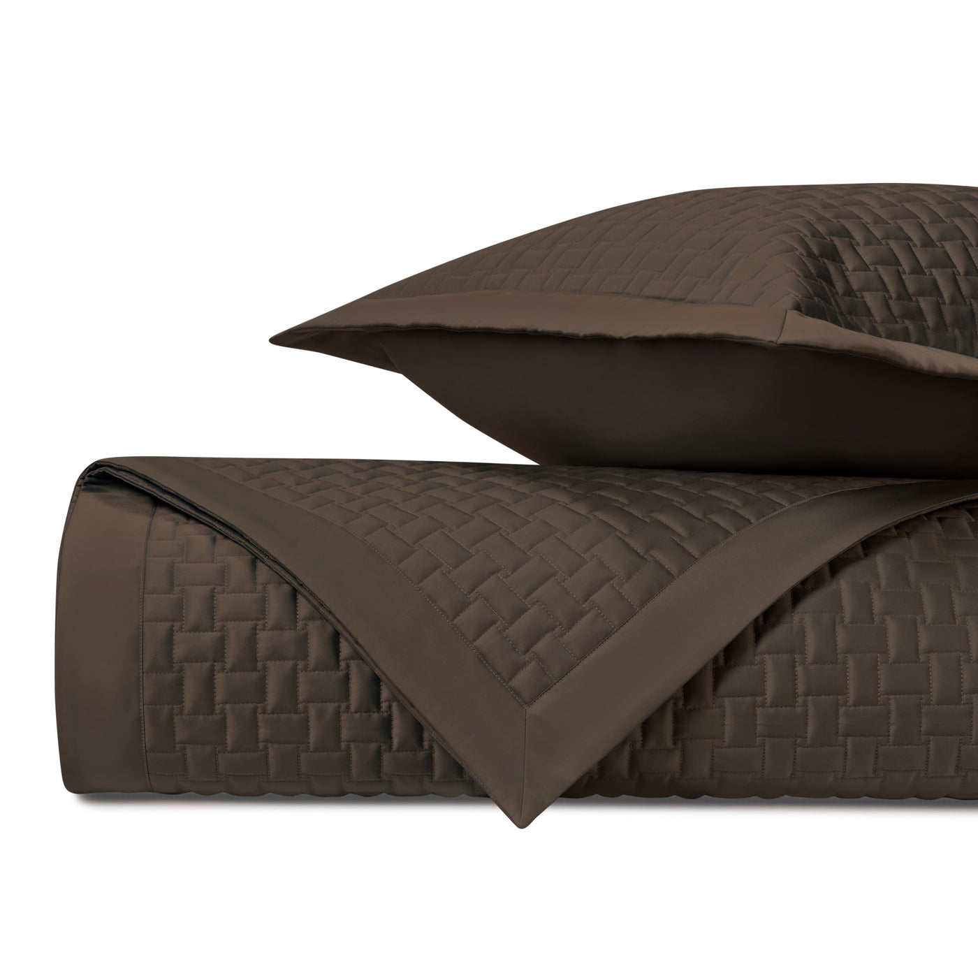 Close-up of Home Treasures Wicker quilted coverlet in espresso, showing basket-weave texture.