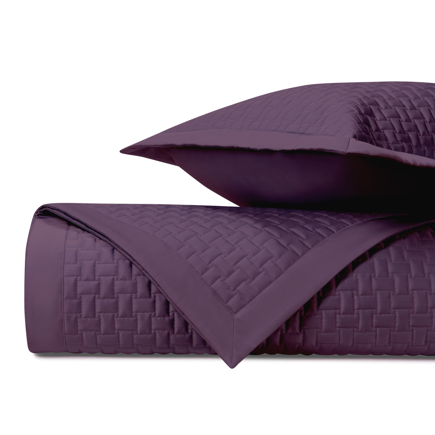 Close-up of Home Treasures Wicker quilted yardage in deep plum with basket-weave texture.