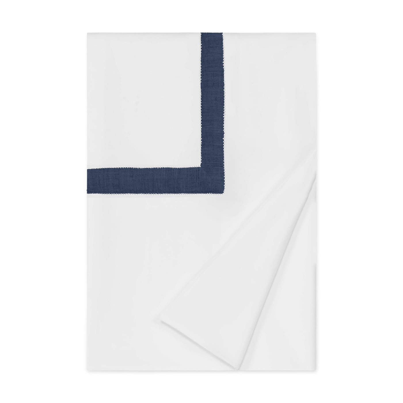 Close-up of navy border embroidery detail on white cotton duvet cover, folded flat.